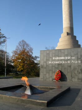 Monument; eternal flame; laid; architectral building; styles; park