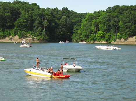 A photograph of motorized boats on a waterway.