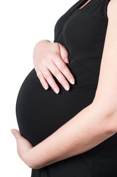 Shot of pregnant woman's belly in black dress