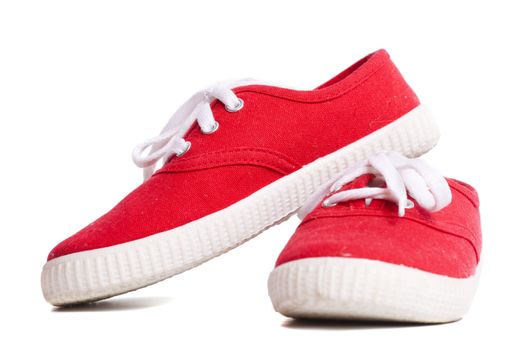 Red vivid new Sneakers isolated on white