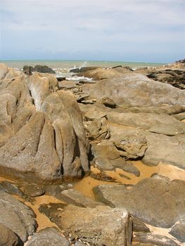 Boulders dot the coast near Trinity Beach of Cairns, Queensland - Australia.