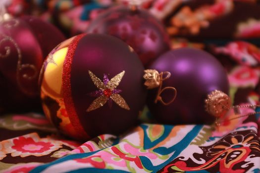 Colorful purple metallic Christmas ornaments for the holidays. Christmas tree decorations for the season.