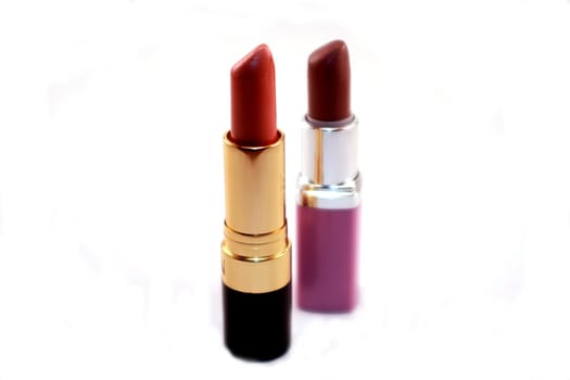 Two tubes of colorful lipstick isolated on white background. Women’s cosmetics and make-up for beauty and fashion.