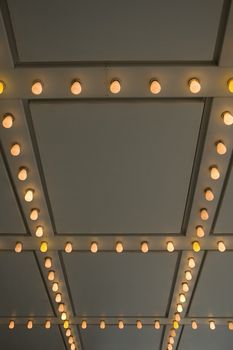 photo of cinema entrance, bulbs, simple background