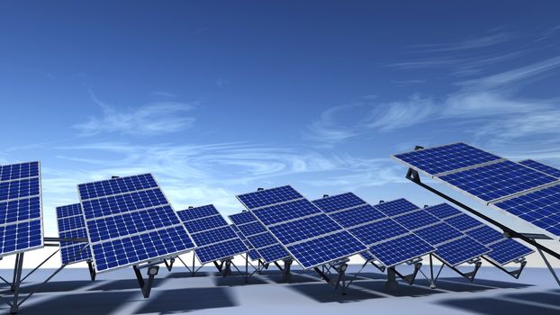 Field of articulated solar panels with morning light and a blue sky with some cirrus clouds