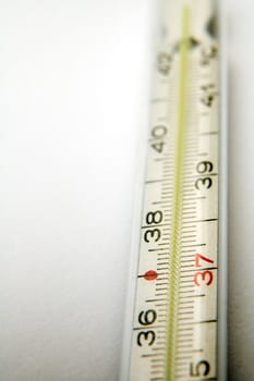 detail photo of medical thermometer on white background, distance blur