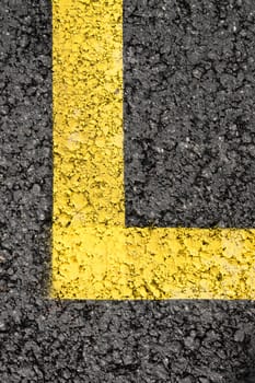 Yellow stripe corner on asphalt surface