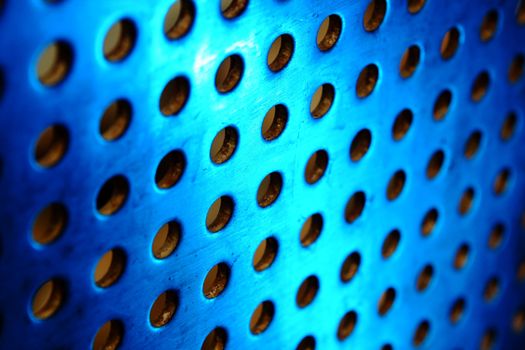 metal background with circles with blue toned