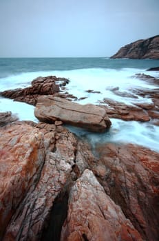 Sea stones at sunset in hong kong.