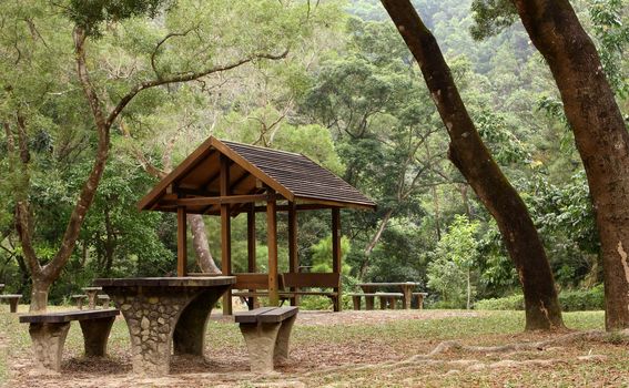 Picnic table and pavilion at countryside at day
