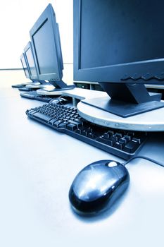 workplace room with computers in row close up
