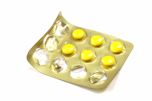 Package of Yellow Pills isolated on white