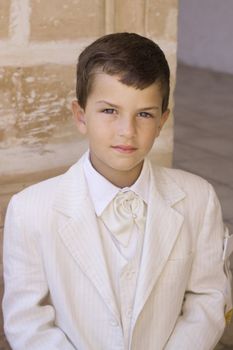 A young boy celebrating his first holy communion
