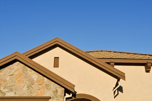 New Stucco Home Under Construction with Blue Sky