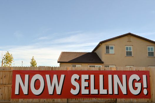 Now Selling Homes Sign