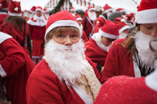 RIGA, LATVIA - DECEMBER 12: Participants of the third annual Santas Fun Run &amp; Walk in Riga, Latvia, 12 December, 2010