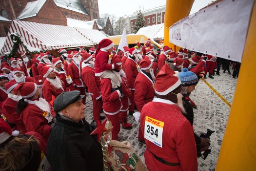 RIGA, LATVIA - DECEMBER 12: Participants of the third annual Santas Fun Run & Walk in Riga, Latvia, 12 December, 2010