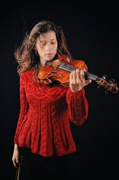 Musician playing violin. Isolated on the black background