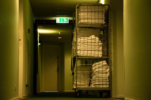 Hotel floor with towels on trolley