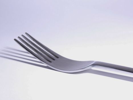 close-up of an eating silver fork. isolated 