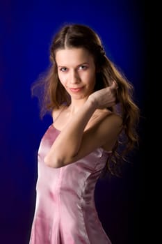Portrait of Young woman in over dark blue background
