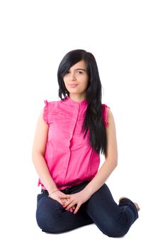 Portrait of Young woman sitting on floor isolated on white