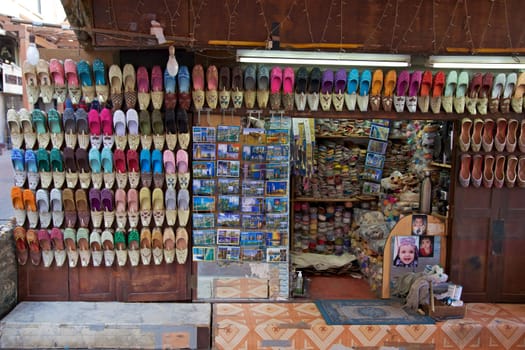 Arabian shoes on sale in a traditional souk in old Dubai, UAE.