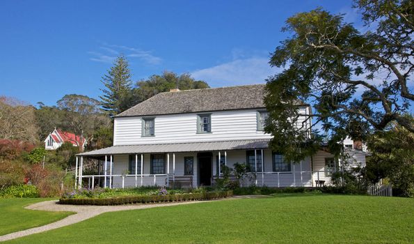 Mission House (1822), the oldest wooden strcuture in New Zeakand, in the Kotorigo-Kerikeri Basin Heritage Area of North Island. St James Anglican Church is in the background. 