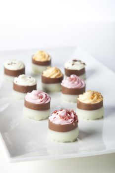 Gourmet chocolate candies with icing.