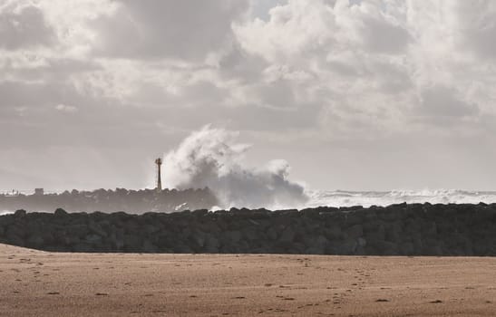 Big wave on a blocks jetty during a storm