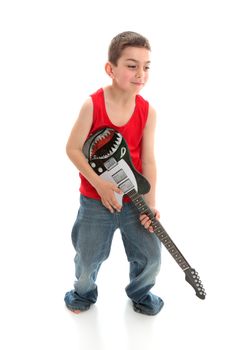 Little boy playing a guitar on a white background.