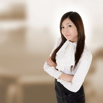 Attractive modern executive of Asian woman in business building.