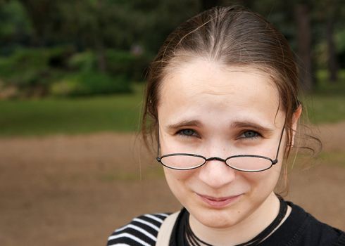 Girl with glasses looking confused