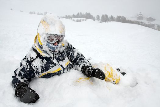 Skier in the snow after falling over