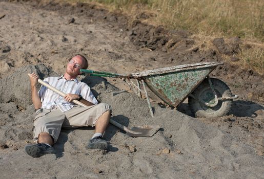 Young man working on a construction having a rest