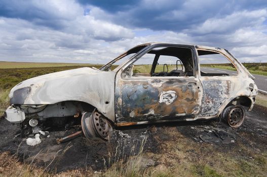 HATERSAGE MOOR 5 July 2010 UK: Stolen vehicle burnt out on Hathersage Moor in Peak District National Park Derbyshire England: UK 5 July 2010