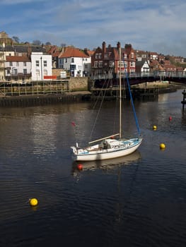 A boat at rest near the swingbridge at Whitby