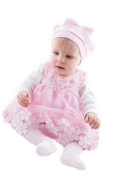 Baby girl in pink dress over white background