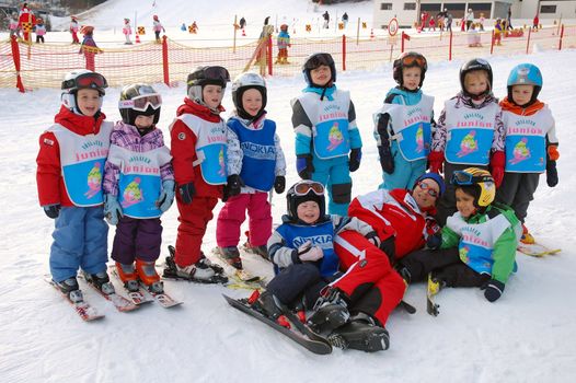 ZELL AM SEE, AUSTRIA - DECEMBER 22: 3-5 year old children at Ski school in Zell am See, Austria. Austrian ski schools are famous for the training plans, that guarantees the safety of about 10 million ski drivers on austrian ski areas per year.