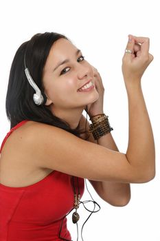 Beautiful dark haired girl enjoying music on ear phones