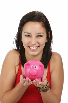 Gorgeous smiling young lady holding a pink piggy bank
