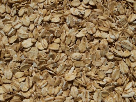 Closeup of dried, pressed oatmeal, healthy diet concept