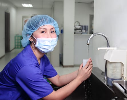 female nurse performing handwashing