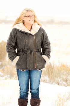 A fashionable Mom standing in the snow.