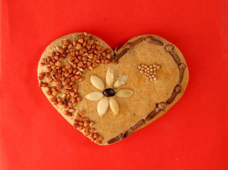 Lovely heart, made of bread, grits, seeds and clove.
Valentines and love concept.