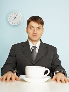 The businessman has drunk record quantity of black coffee and stare wide-eyes
