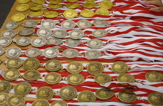Many gold, silver and bronze medals waiting for the winners