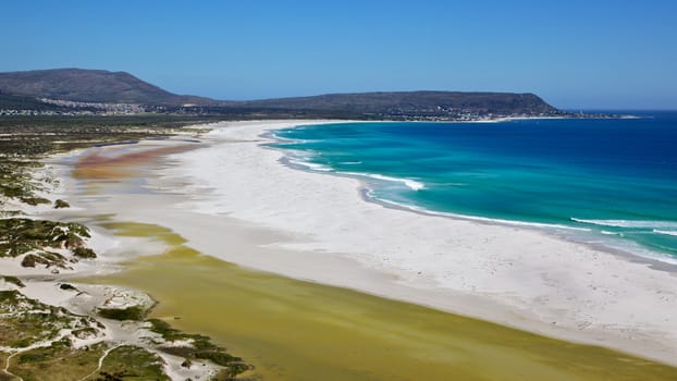 The expanse of Long Beach, with Kommetjie in the background, Cape Peninsula, South Africa.