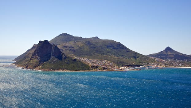 The Sentinel guarding the entrance to Hout Bay and its harbor, Cape Peninsula, South Africa.