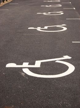 Parking place for handicapped. Sign painted on asphalt